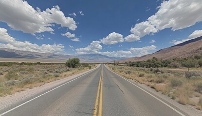 Naklejka premium Desert Highway Under Blue Sky with Mountains in Background