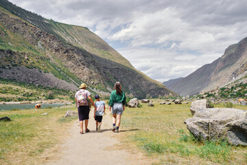 Obraz premium mother-son hiking in the mountains