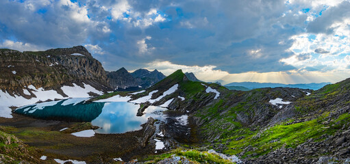 highland lake in Swiss Alps mountains. Small lake in highlands. Alpine valley Grindelwald. Jungfrau...