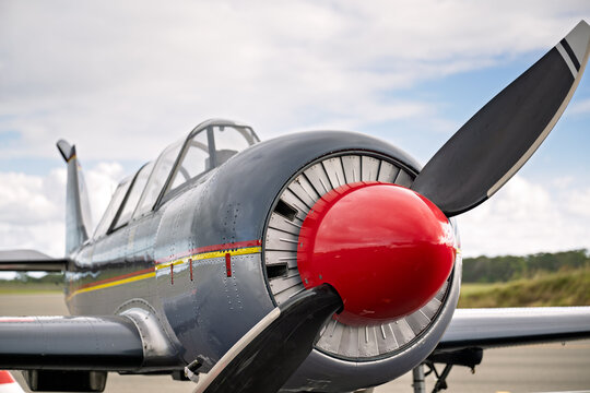 Bundaberg, Queensland, Australia - May 10 2025: Yakovlev Yak-52 training aircraft, airplane aeroplane plane, closeup view front propeller, on runway ground