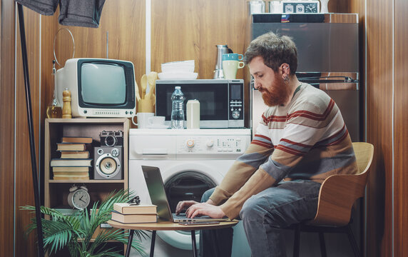 Young man living and working in a tiny home