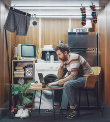 Young man living and working in a tiny home