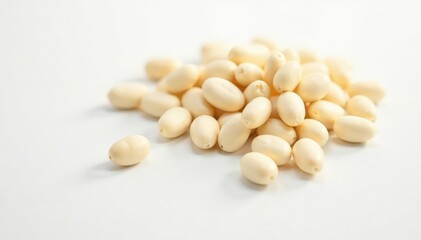 Scattered white beans against a stark white background, pantry, protein