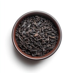Dark, loose leaf tea in a bowl