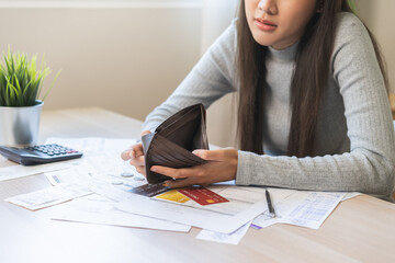 Fototapeta na wymiar Debt financial concept, stressed problem asian woman hand open empty wallet, purse not have budget of money to pay no have credit card, not able payment bill, loan or expense with bank, bankruptcy.