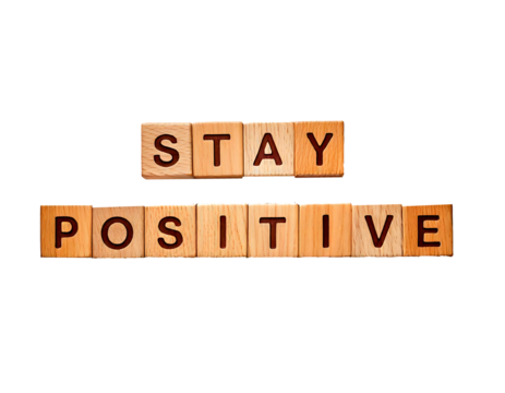 Stay positive text on wooden cubes; motivation and inspiration concept on transparent background and white background 
