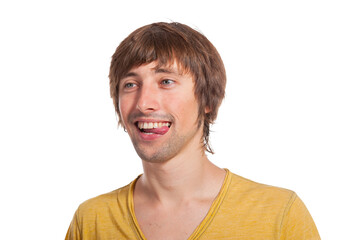 Obraz premium Joyful young man shows playful energy with a cheerful smile in-studio