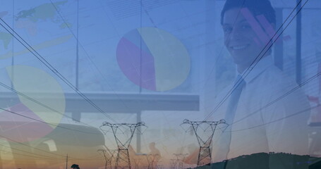 Image of statistics and data processing over biracial businessman and electricity pylons