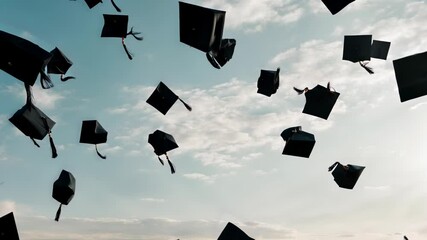 Caps being thrown into the sky during a graduation ceremony under a blue sky with clouds - Powered by Adobe