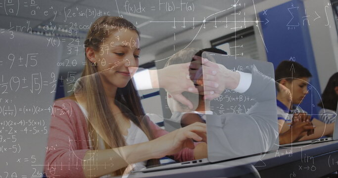 Image of math formulas moving over caucasian girl using laptop at school