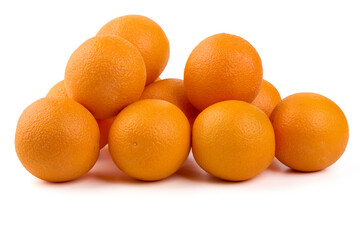 Pile of fresh whole oranges, isolated on white background