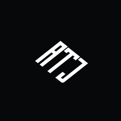 ATJ letter logo design on black background.