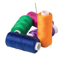 Colorful spools of thread with a needle on transparent background