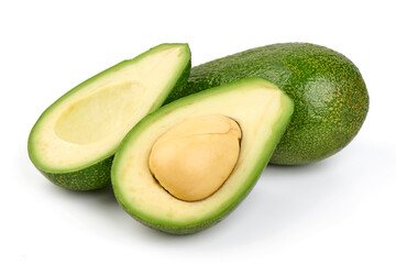 Fresh green avocados, whole and halved with kernel, isolated on white background.