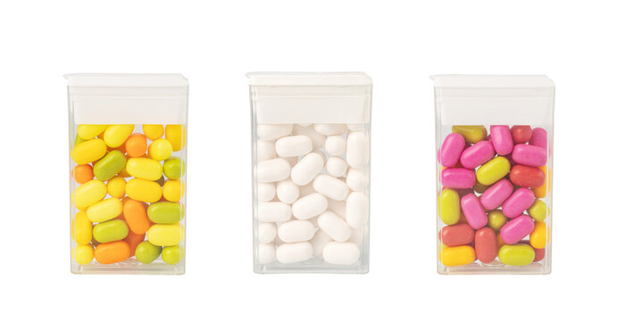 Colorful tic tacs in transparent boxes on transparent background