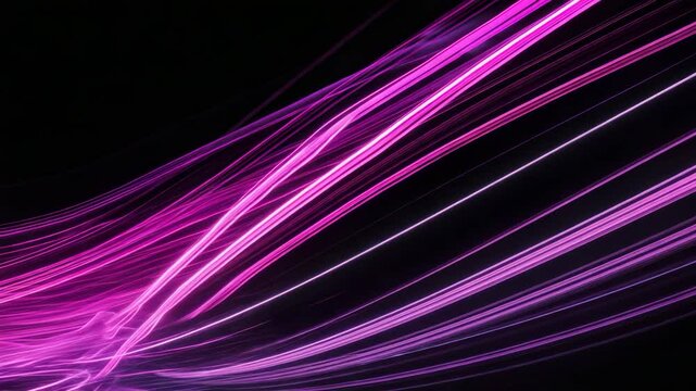 Abstract pink purple swirls in parallel lines pattern captured through long exposure light painting photography on a black background.