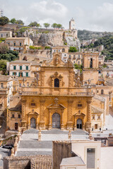 Panoramic view of historic Modica in Sicily with baroque architecture, terracotta rooftops, and the Cathedral of Saint Peter. A UNESCO-listed gem in southern Italy