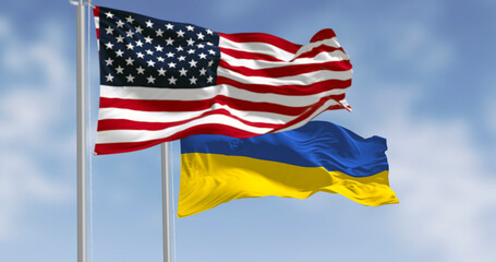 Ukraine and US national flags waving on a clear day