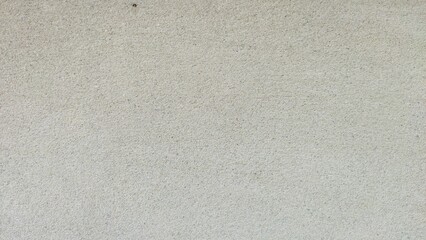 Gray wall texture surface with subtle grain pattern. Ideal for backgrounds or design projects.