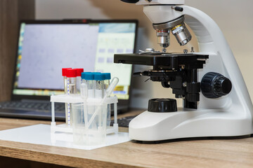 Laboratory microscope and test tubes