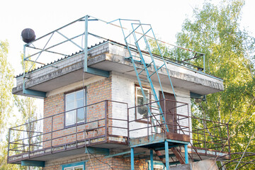 Obraz premium Observation two-story building brick building with stairs and balcony in Ukraine in the summer
