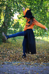 Happy family walk in the park on Halloween. Family dressed up in Halloween costumes