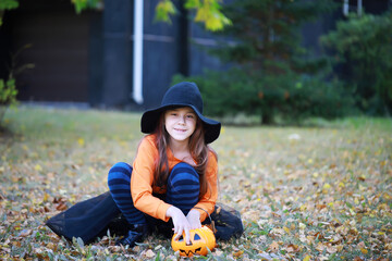 Happy family walk in the park on Halloween. Family dressed up in Halloween costumes