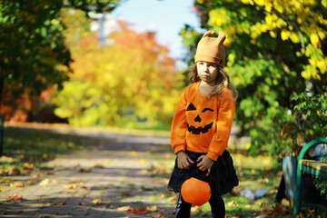 Happy family walk in the park on Halloween. Family dressed up in Halloween costumes