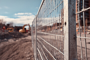 Obraz premium Steel Mesh Fencing at Large Construction Site Entrance