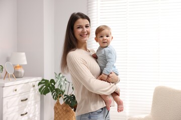 Mother with her cute little baby at home