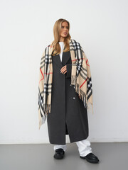 Captivating fashion model showcasing modern elegance in a stylish studio environment