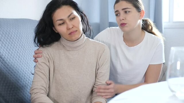 Annoyed stressed woman ignoring girlfriend after quarreling at home, LGBTQ relationship problems concept