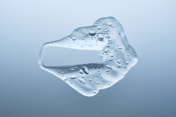 The texture of a cosmetic gel with bubbles on a blue background.