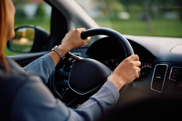 Close up of woman driving car.