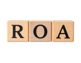 Wooden blocks displaying the letters R, O, and A in black font.