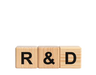 Wooden blocks displaying the letters R & D, representing research and development.