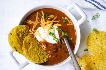 Homemade Black bean soup with totilla cips, selective focus