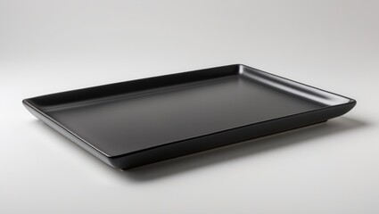 Rectangular black ceramic plate without contents, side view isolated on background with clipping path