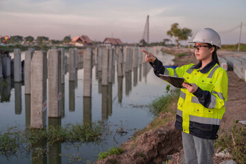 Civil Engineers Consult on Pile Driving in Water,Working at site of a large building project Construction Site Collaboration,Discuss Construction Project,Building Foundations at the Site