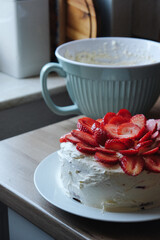 Homemade white sponge cake with mascarpone cheese and strawberries. Homemade summer baking. 