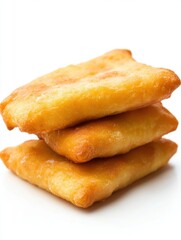 Stack of fried dough pastries on white background close up studio shot food photography breakfast snack dessert