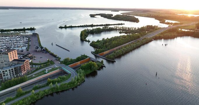 aqueduct, The Veluwemeer Aquaduct, vehicle and waterway ships passing infrastrucutre integrated into nature.