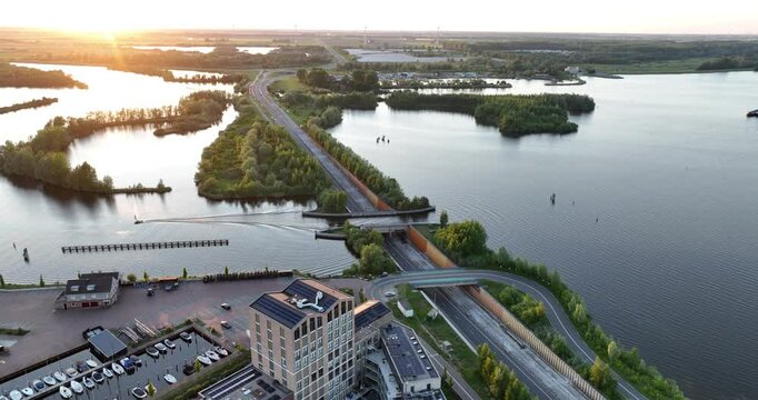 aqueduct, The Veluwemeer Aquaduct, vehicle and waterway ships passing infrastrucutre integrated into nature.
