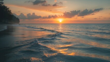 Dramatic sunset sky with golden clouds and horizon sea backdrop