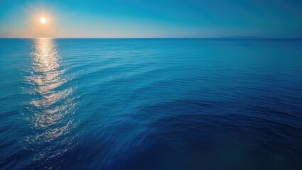 Obraz premium Scenic beach landscape featuring the blue sea, sunshine, and peaceful horizon