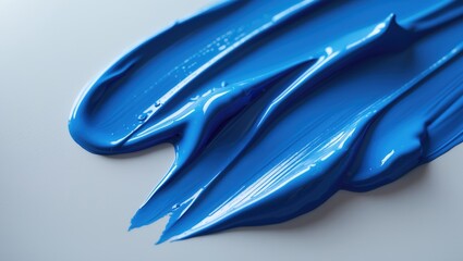 Vibrant blue paint strokes with liquid texture on modern art backdrop