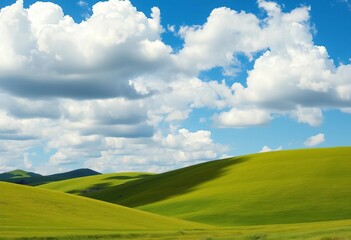 Obraz premium Rolling green hills stretch to a vibrant blue sky dotted with fluffy white clouds, field, pastoral