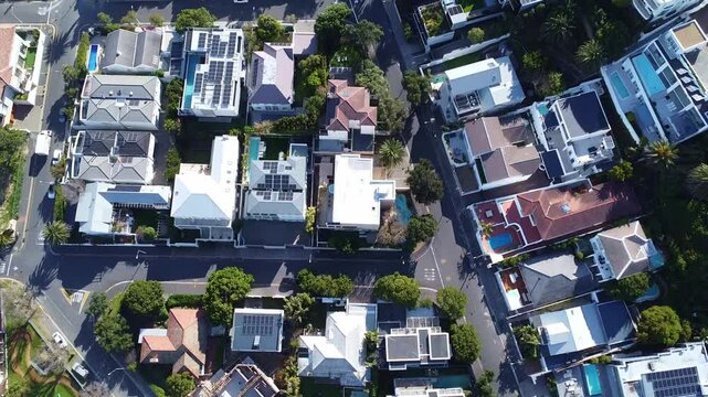 Aerial view of a residential neighborhood with houses trees roads and swimming pools on a sunny day south africa