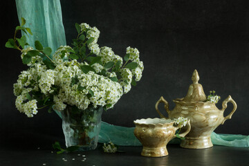 green vase with flowers