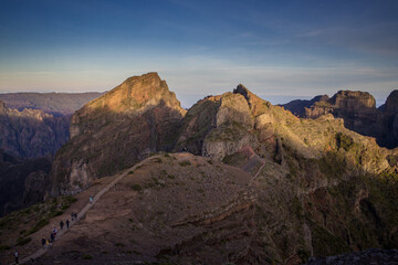 Fototapeta premium Exploring Pico do Arieiro in Madeira during early morning light with hiking trails and stunning mountain views